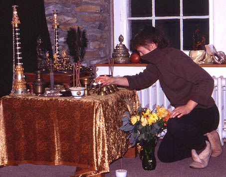 2003 Retreat, Beth attends to the altar